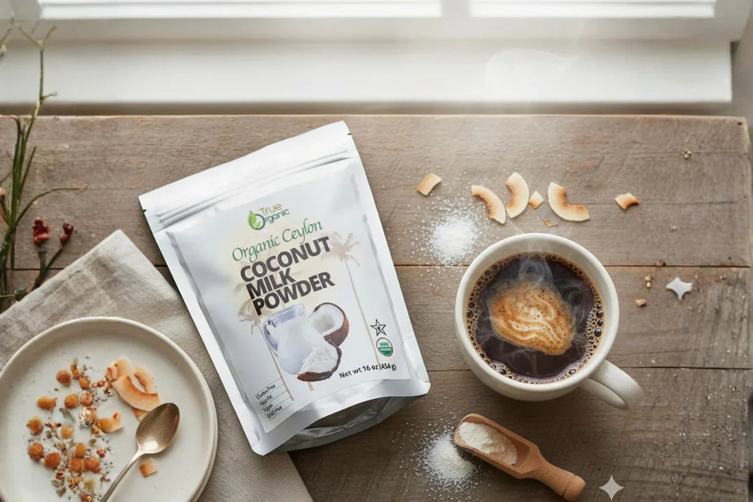 Organic Ceylon coconut milk powder package next to steaming coffee cup and coconut flakes on wooden table
