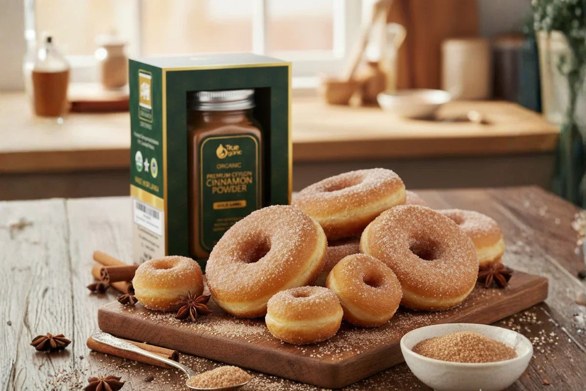 Cinnamon-sugar donuts on wooden board with organic cinnamon powder in kitchen setting