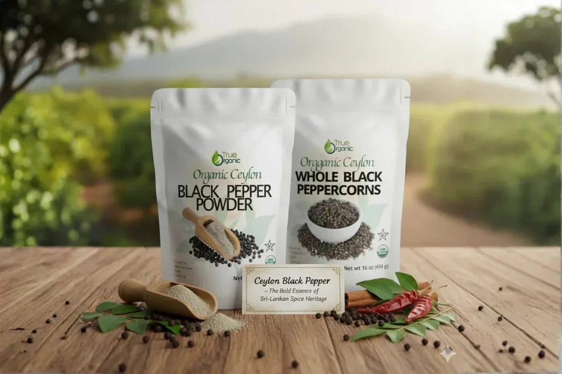 Organic Ceylon black pepper powder and whole black peppercorns packages on wooden table with spices and greenery background