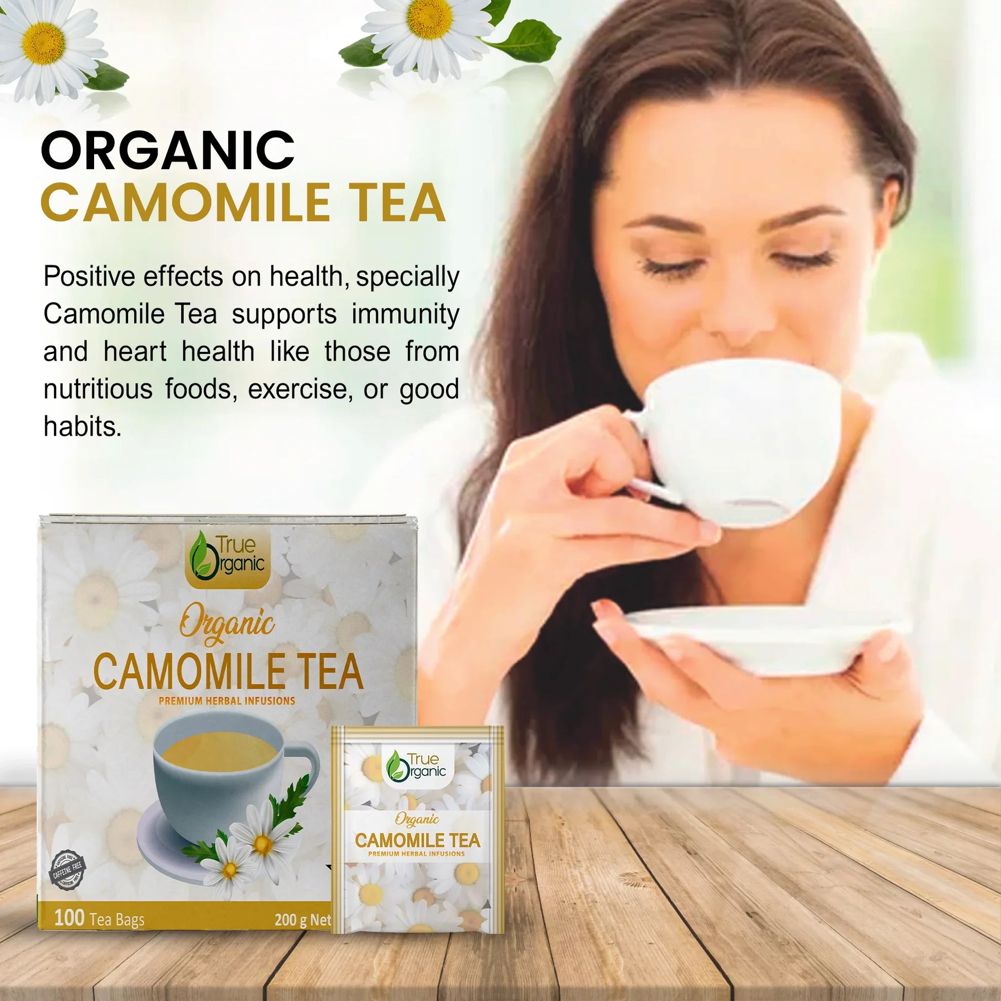 Woman drinking organic chamomile tea with True Organic tea packaging on wooden table