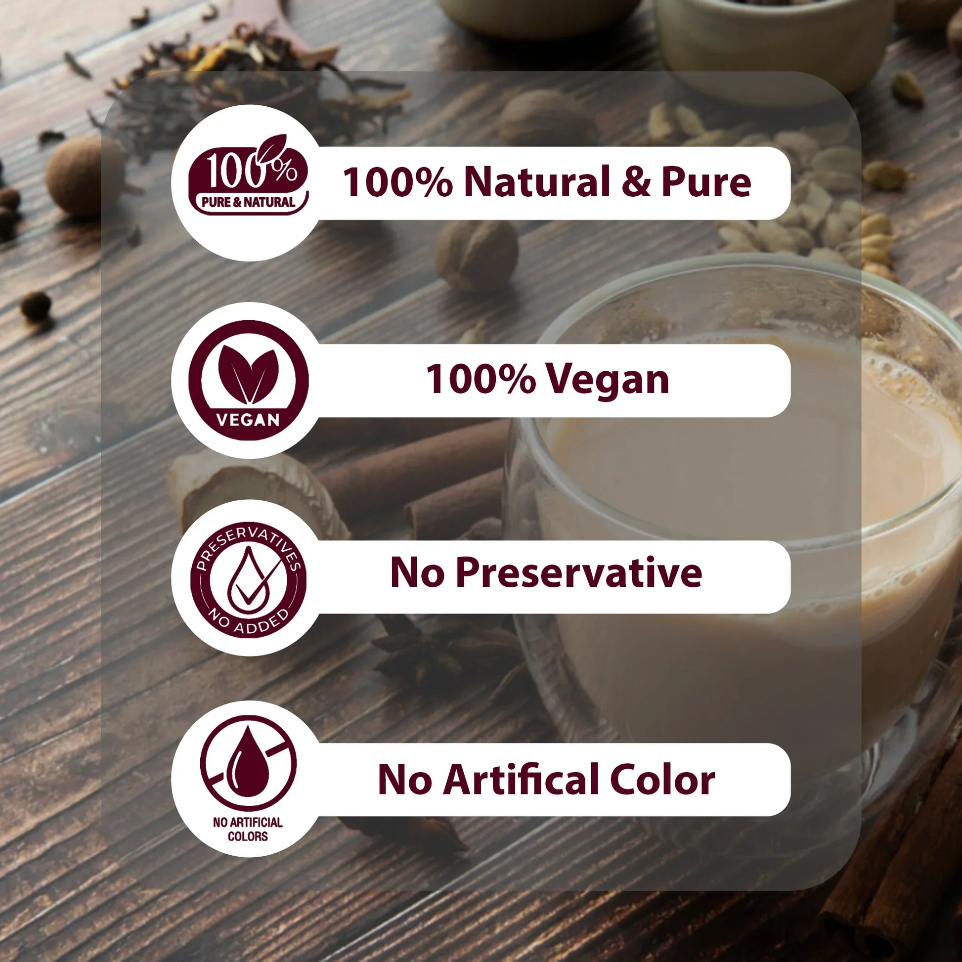 Glass cup of creamy beverage on wooden table with spices and text highlights 100% natural, vegan, no preservative, no artificial color