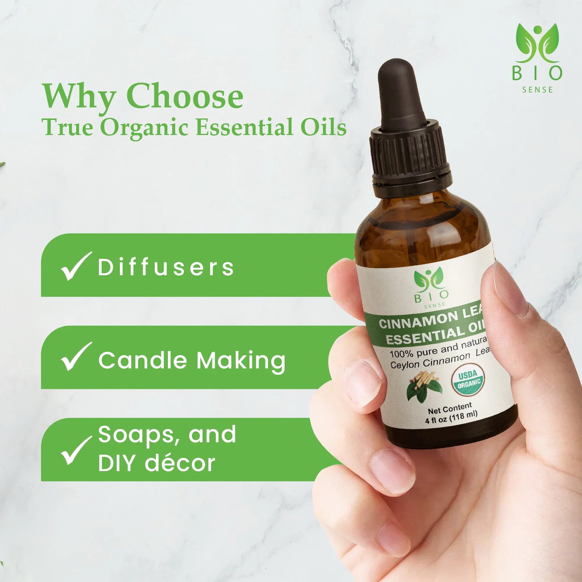 Hand holding Bio Sense cinnamon leaf essential oil bottle with uses for diffusers, candle making, soaps, and DIY décor