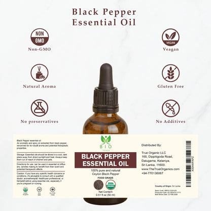 Brown glass bottle of Black Pepper Essential Oil with labels showing non-GMO, vegan, gluten-free, and natural aroma