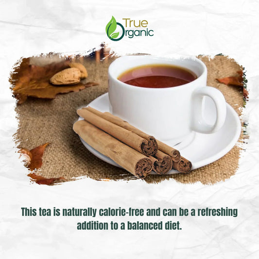 White cup of tea with cinnamon sticks on burlap background and True Organic logo