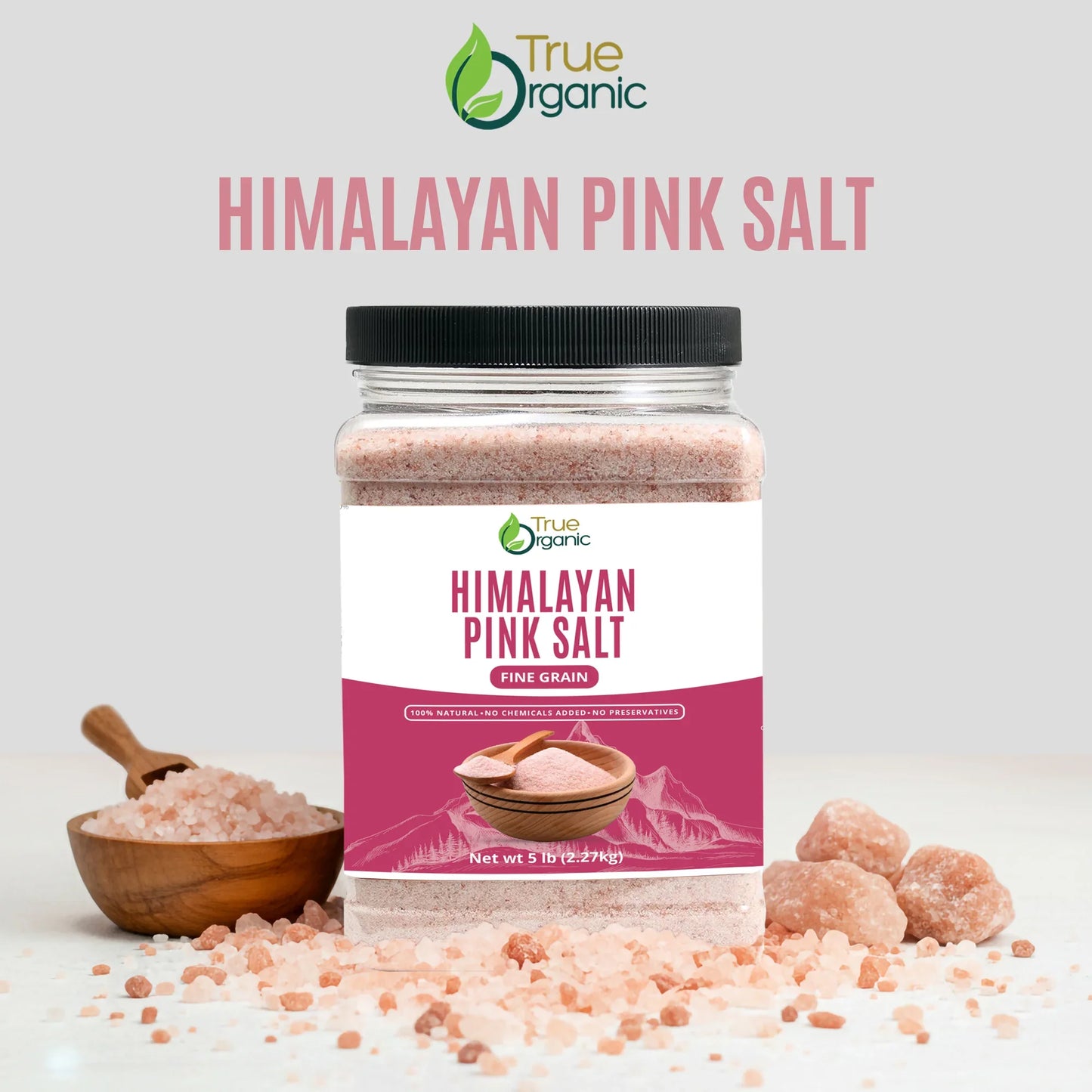 True Organic Himalayan Pink Salt in 5 lb container with fine grain salt and pink salt crystals on white surface