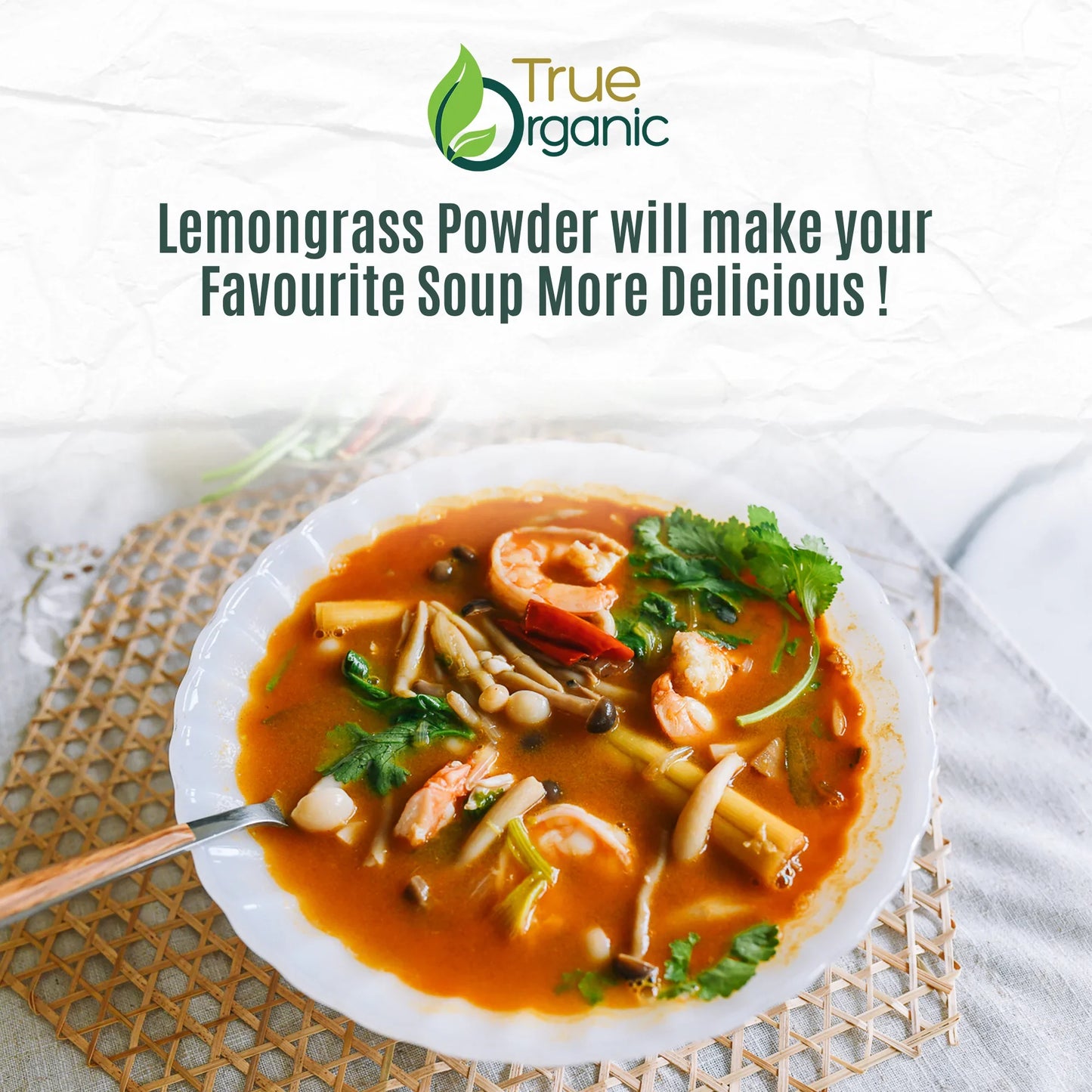 Bowl of shrimp and lemongrass soup with mushrooms and cilantro on woven placemat