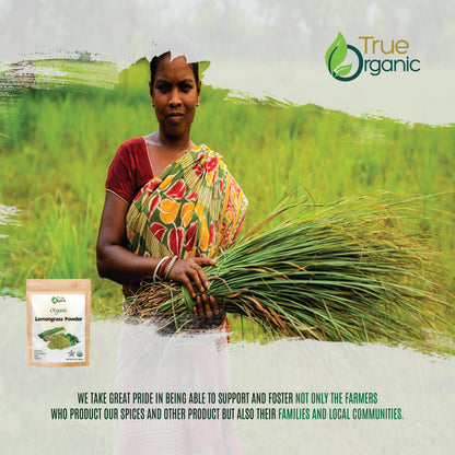 Woman farmer in colorful saree holding fresh lemongrass in green field with True Organic logo