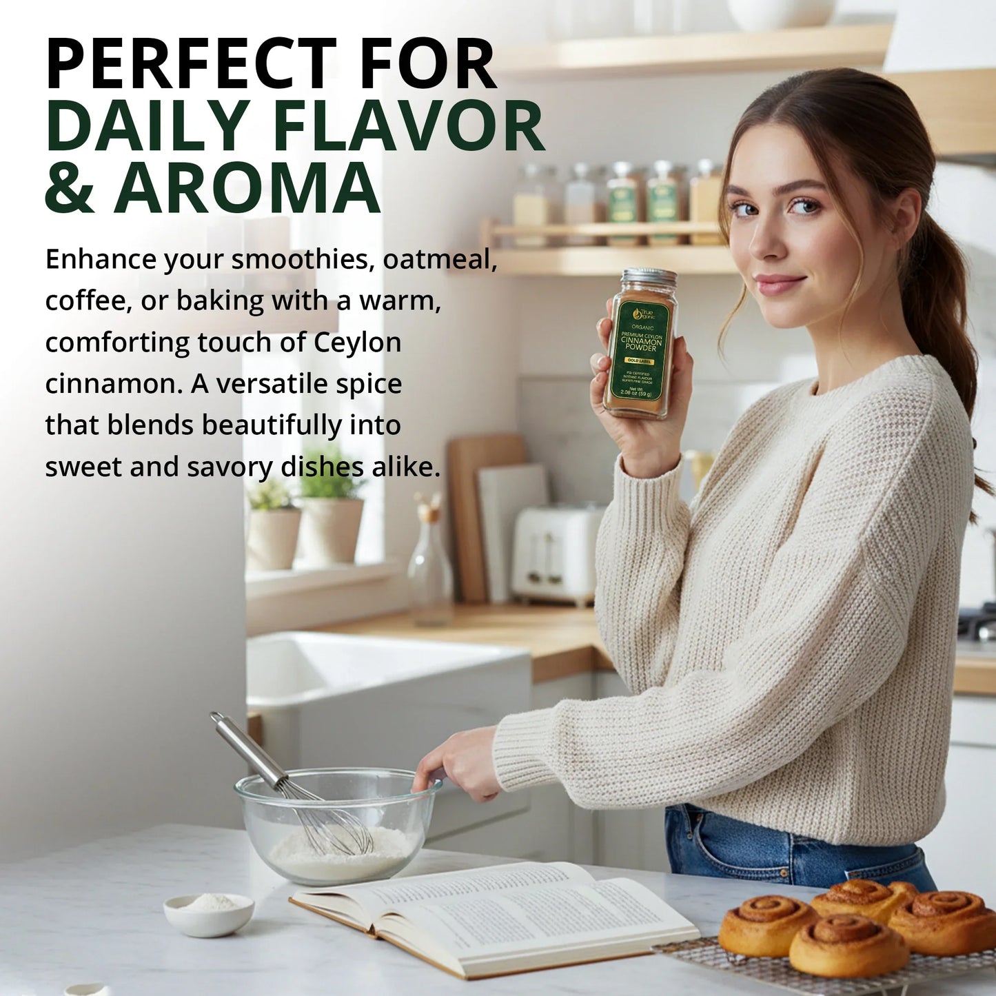 Woman in cozy sweater holding organic Ceylon cinnamon powder jar in bright kitchen with baking ingredients